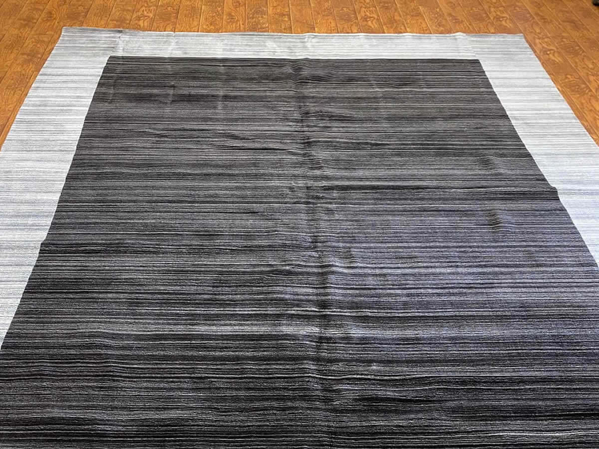 faded black and white rug for appraisal